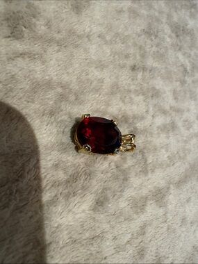 Gold Pendant with Deep Red Oval Gemstone